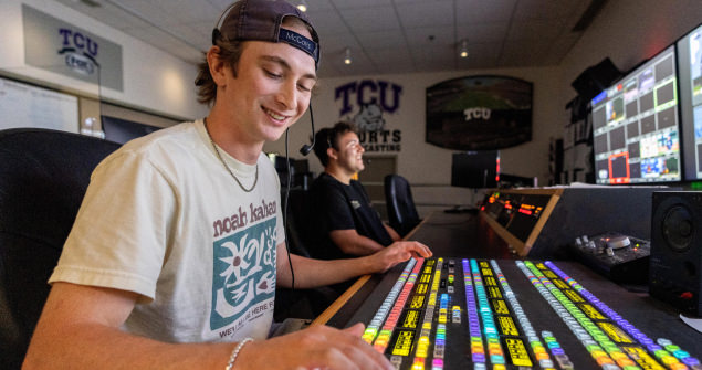 Two students working in a room for sports broadcasting