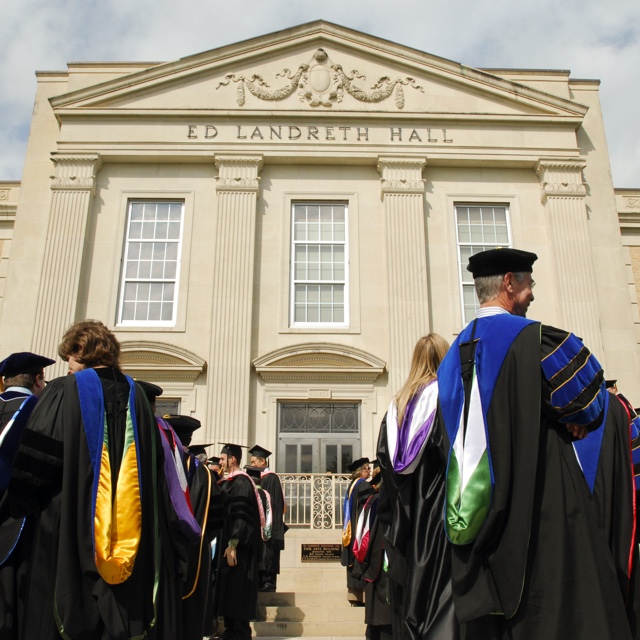 Faculty outside of Ed Landreth Hall