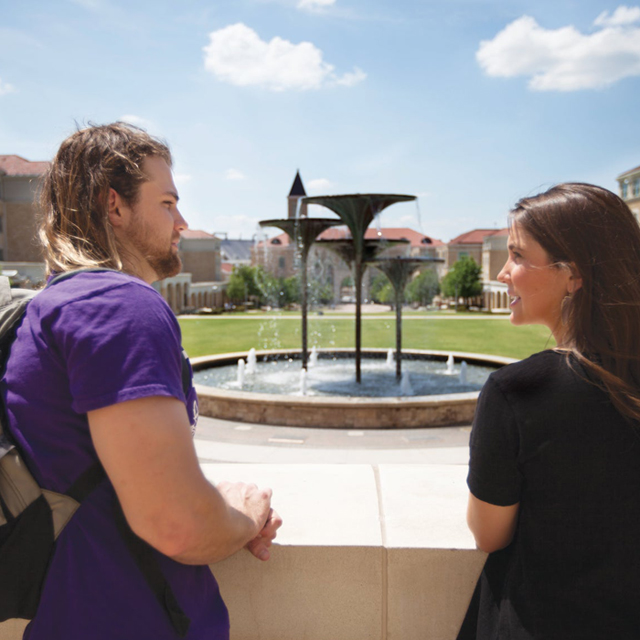 students with Frog Fountain in the background