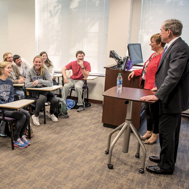 President George W. Bush speaks to a class