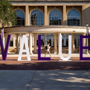 Values word statue on the side of the library