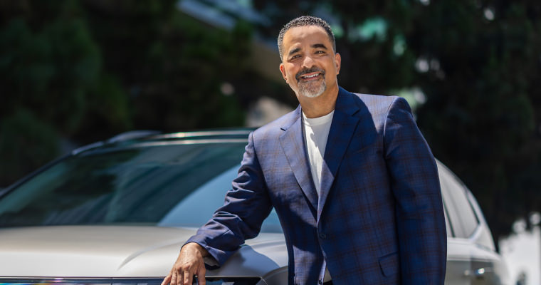 Randy Parker with a Hyundai EV in the background