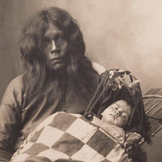 A Caddoan Woman and baby photographed in 1898